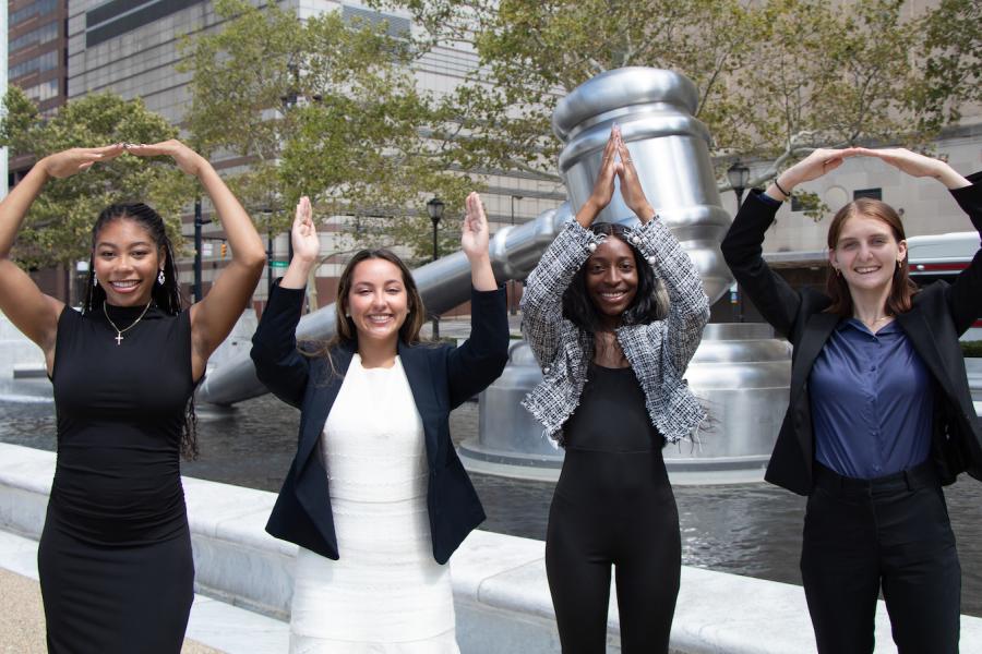Students posing in front of World's Largest Gavel