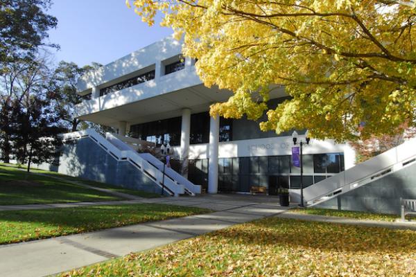Photo of Emory Law School Building in Fall with tree in foreground