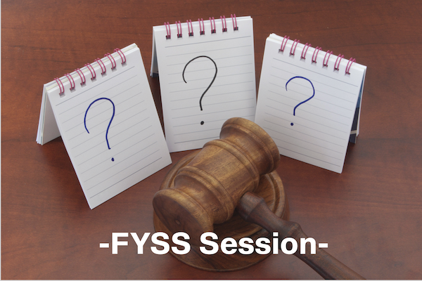 Gavel in front of note cards with question marks